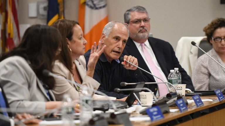 MTA board members clash over overtime allegations: 'There's blood on your hands' 4 MTA board finance committee chairman Lawrence Schwartz, center, argues with Transport Workers Union president John Samuelsen about workers' overtime.