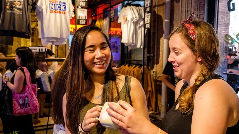 Rayna Sims (left), 23, of the Upper East Side and Sarah Sabatke, 23, of Columbia, Missouri, peruse the JoBros-branded items on Friday. 