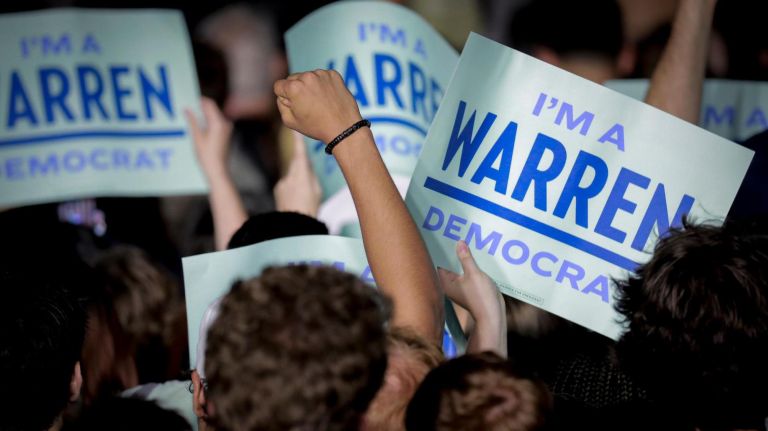 Elizabeth Warren supporters held signs that said, "I'm a Warren Democrat," as the candidate spoke in&nbsp;Washington Square Park Monday night.
