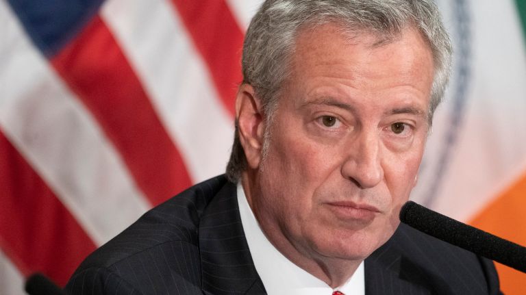 Mayor Bill de Blasio on Tuesday proposed a law that would provide health insurance coverage for family members of all city employees who die from 9/11-related illnesses.