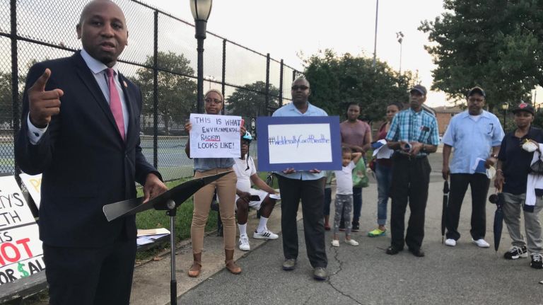 City Councilman Donovan Richards, a sponsor of the "waste equity" legislation, joins southeastern Queens residents at a rally calling for the bill's passage.