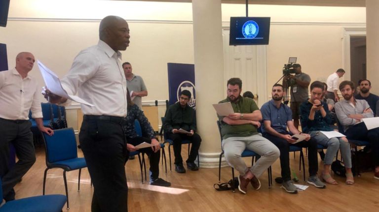 Brooklyn Borough President Eric Adams, second from left, holds a town hall meeting on parking placard abuse at Borough Hall on Tuesday.