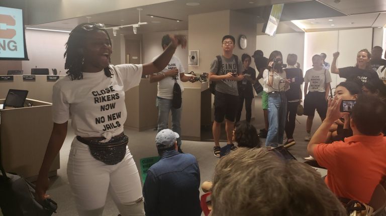 Protestors react to the City Planning Commission's decision.