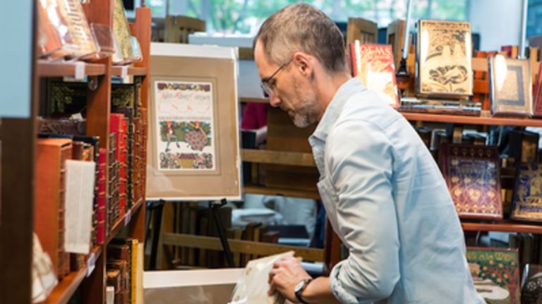 A man browses antique books at last year's Brooklyn Antiquarian Book Fair.
