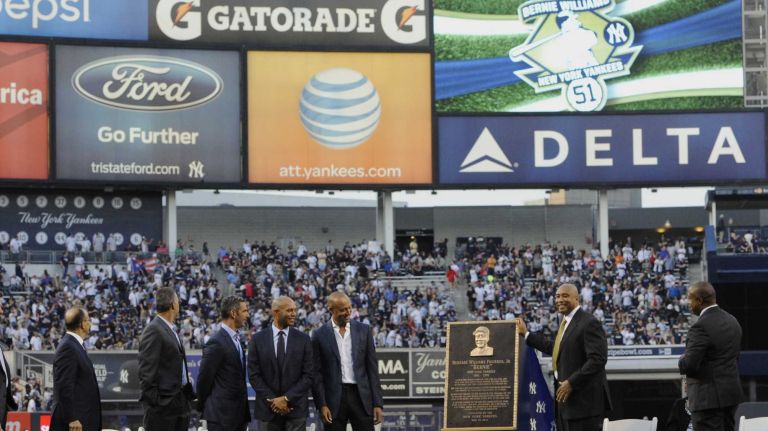 From left, former New York Yankees manager Joe Torre, Andy Pettitte, Jorge Posada, Mariano Rivera, Derek Jeter and Bernie Williams react during a ceremony to retire Williams' No. 51 before a game between the Yankees and the Texas Rangers at Yankee Stadium on Sunday, May 24, 2015.