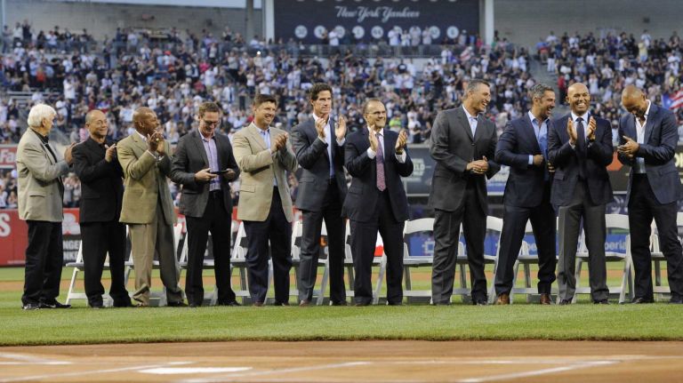 Former New York Yankees greats react during a ceremony to honor Bernie Williams and retire his No. 51 before a game between the Yankees and the Texas Rangers at Yankee Stadium on Sunday, May 24, 2015.