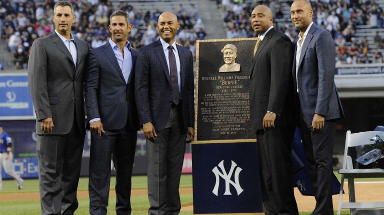 From left, former New York Yankees Andy Pettitte, Jorge Posada, Mariano Rivera, Bernie Williams and Derek Jeter pose together during a ceremony to retire Williams' No. 51 before a game between the Yankees and the Texas Rangers at Yankee Stadium on Sunday, May 24, 2015.