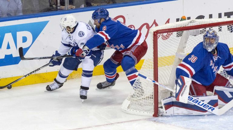 The New York Rangers' Kevin Klein checks Ryan Callahan of Tampa Bay Lightning in the first period during Game 2 of the Eastern Conference finals at Madison Square Garden on Monday, May 18, 2015.