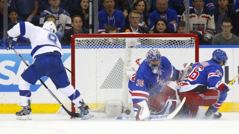 Tyler Johnson #9 of the Tampa Bay Lightning scores a first-period shorthanded goal against Henrik Lundqvist #30 of the New York Rangers during Game 2 of the Eastern Conference finals at Madison Square Garden on Monday, May 18, 2015.