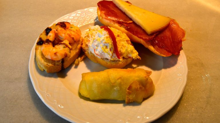 If San Miguel isn't your first meal in Spain, you have almost definitely already had tapas. But the tapas at Que Bonito es Panama (Nos. 41, 42, 56 and 57), are going to be some of the best you'll have. As you can see by the numbers of the stall, this place is huge, and thus offers a huge variety of tapas. My personal favorites are the brie cheese roll and the salmon with surimi on toast, but for 2-3 euros I really don't think you can go wrong here. For places like this, the more people you go with, the better, because that means you can try more bites.