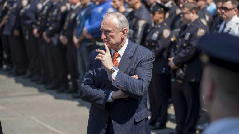 New York City Police Commissioner Bill Bratton stands with other officers at Jamaica Hospital in Queens, where Officer Brian Moore died on Monday, May 4, 2015.