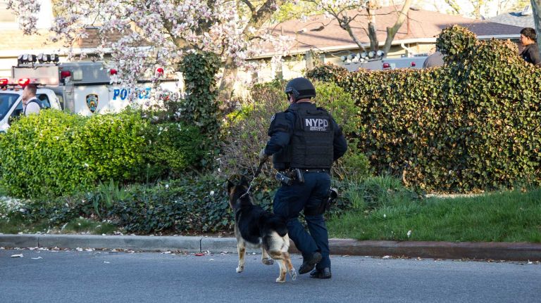 A New York police officer was shot and wounded in Queens Village on Saturday evening, May 2, 2015, setting off an intense search for the suspect. 