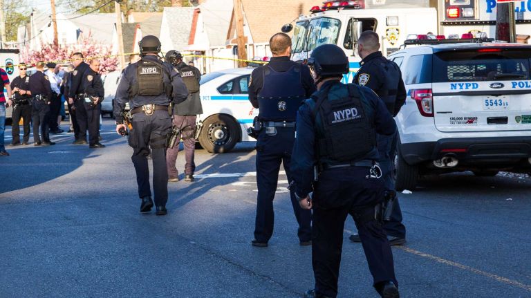 Police search for the shooting suspect in Queens Village on Saturday evening, May 2, 2015.