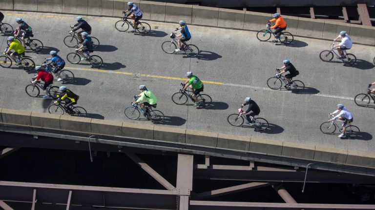 Participants move across the Ed Koch Queensboro Bridge as they take part in the Five Boro Bike Tour Sunday, May 3, 2015.