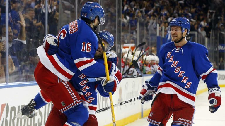 Rangers vs. Capitals: Game 2 of round 2 of Stanley Cup playoffs 21 Derick Brassard #16 of the New York Rangers celebrates his third-period goal against the Washington Capitals with teammates Martin St. Louis #26 and Kevin Klein #8 during Game 2 of the Eastern Conference semifinals at Madison Square Garden on Saturday, May 2, 2015.