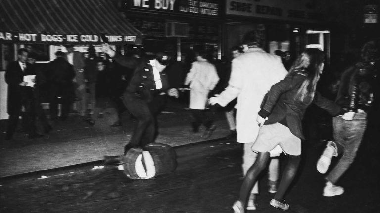 A cop puts his foot to a fallen demonstrator on a side street just off 6th Avenue in New York City at an anti-Rusk demonstration. (Nov. 14, 1967)