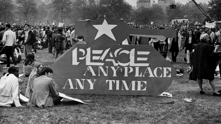 At Sheep Meadow in Central Park, cardboard cut in the shape of an Army tank shows the demonstrators feelings for negotiations to end the war. (April 27, 1968)