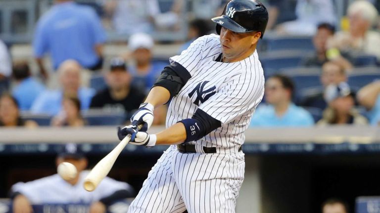 Carlos Beltran #36 of the New York Yankees connects on a second inning double against the Baltimore Orioles at Yankee Stadium on Friday, June 20, 2014 in the Bronx Borough of New York City.