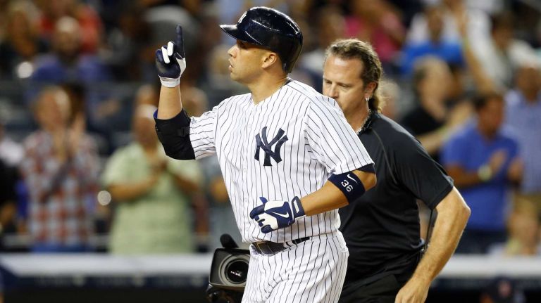 Carlos Beltran #36 of the Yankees celebrates his fourth inning home run against the Boston Red Sox at Yankee Stadium on Sunday, June 29, 2014 in the Bronx.
