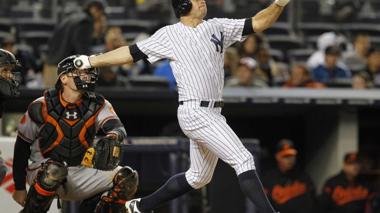 Brett Gardner connects on a two-run homer during the fifth inning against the Baltimore Orioles at Yankee Stadium on April 14, 2013.