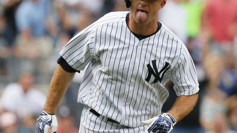 Brett Gardner celebrates after hitting a walk off solo home run in the bottom of the ninth inning against the Detroit Tigers at Yankee Stadium on August 11, 2013.