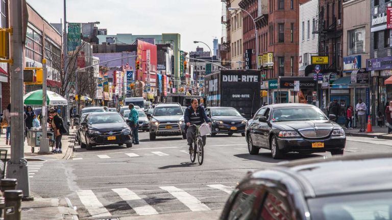 Traffic and pedestrians move along 3rd Ave. in the Melrose neighborhood in the Bronx on April 15, 2015. 