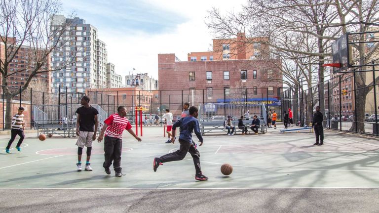 Children play in the Flynn Playground in the Melrose neighborhood in the Bronx on April 15, 2015. Neighborhood feature on Melrose.