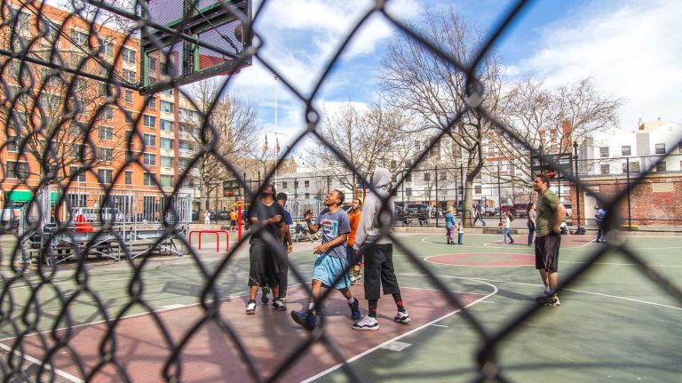 Children play in the Flynn Playground in the Melrose neighborhood in the Bronx on April 15, 2015. 