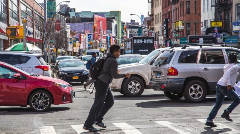 Traffic and pedestrians move along 3rd Ave. in the Melrose neighborhood in the Bronx on April 15, 2015. 