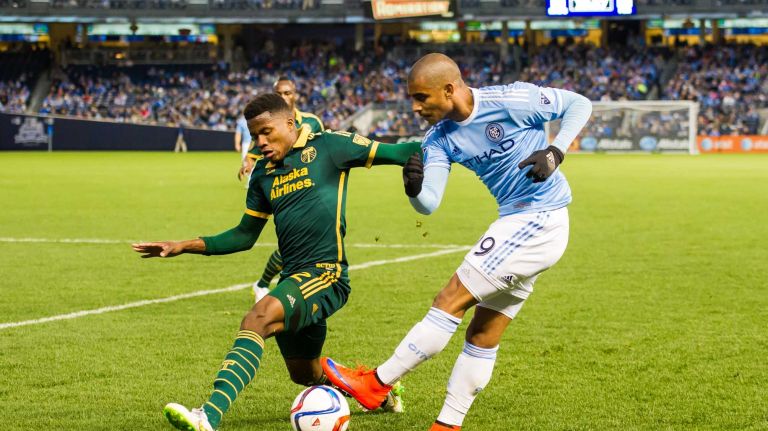New York City FC forward Tony Taylor (99) has his shot blocked by Portland Timbers defender Alvas Powell (2) in a game at Yankee Stadium on Sunday, April 19, 2015.