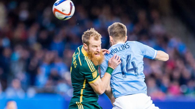 Portland Timbers defender Nat Borchers (7) and New York City FC forward Patrick Mullins (14) battle for the ball in a game at Yankee Stadium on Sunday, April 19, 2015.