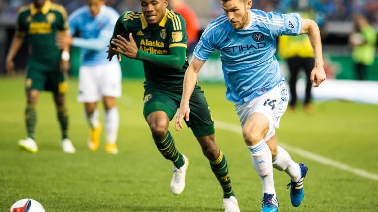 New York City FC forward Patrick Mullins (14) battles for the ball with Portland Timbers defender Alvas Powell (2) in a game at Yankee Stadium on Sunday, April 19, 2015.