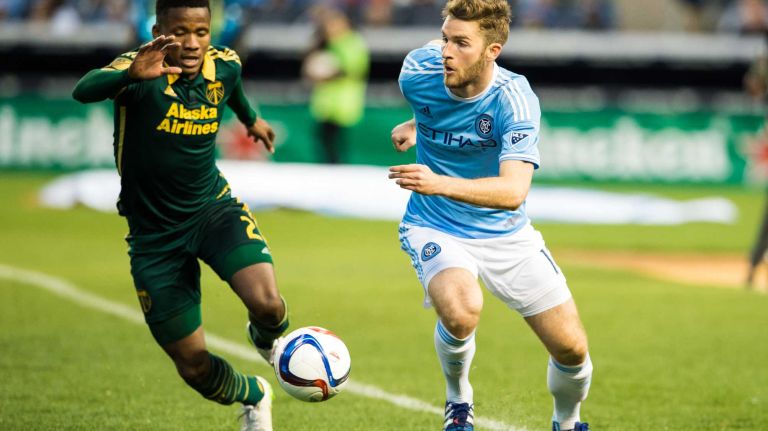 New York City FC forward Patrick Mullins (14) battles for the ball with Portland Timbers defender Alvas Powell (2) in a game at Yankee Stadium on Sunday, April 19, 2015.