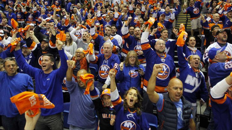 New York Islanders fans cheer after a second-period goal against the Washington Capitals during Game 3 of the Eastern Conference quarterfinals at Nassau Coliseum on Sunday, April 19, 2015.
