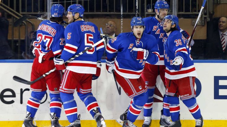 Derick Brassard #16 of the New York Rangers celebrates his first-period goal against the Pittsburgh Penguins during Game 1 of the Eastern Conference quarterfinals with his teammates at Madison Square Garden on Thursday, April 16, 2015.