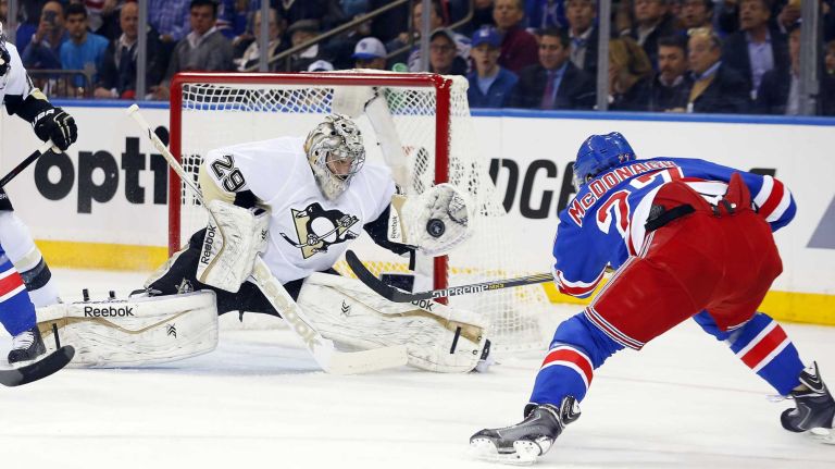 Marc-Andre Fleury #29 of the Pittsburgh Penguins makes a glove save in the first period against Ryan McDonagh #27 of the New York Rangers during Game 1 of the Eastern Conference quarterfinals at Madison Square Garden on Thursday, April 16, 2015.