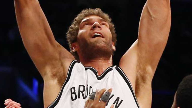 Brook Lopez of the Brooklyn Nets dunks the ball against Amir Johnson of the Toronto Raptors at Barclays Center on Friday, Jan. 30, 2015.