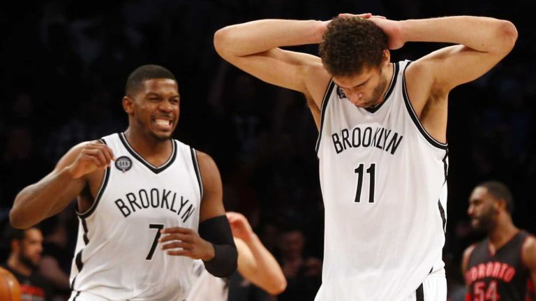 Brook Lopez and Joe Johnson of the Brooklyn Nets react after Lopez missed a potential game-winning shot at the buzzer against the Toronto Raptors at Barclays Center on Friday, Jan. 30, 2015.