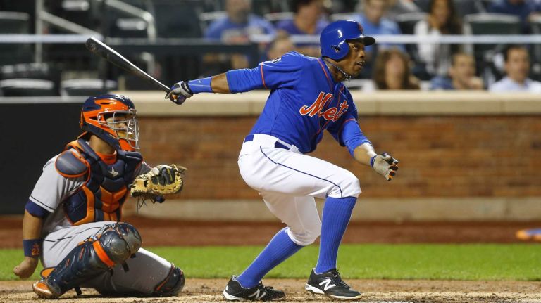 Curtis Granderson of the Mets follows through on a fourth-inning home run against the Houston Astros at Citi Field on Friday, Sept. 26, 2014.