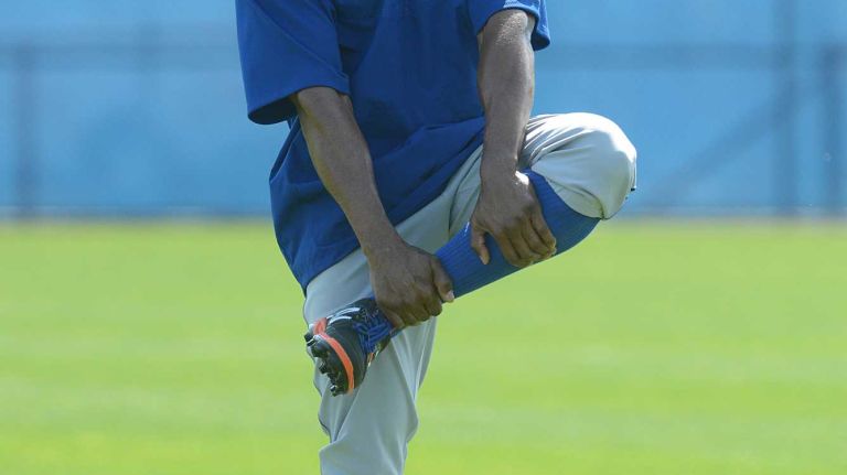 NY Mets outfielder Curtis Granderson warming up during a spring training workout Tuesday Feb 24, 2015.