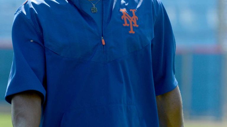 NY Mets outfielder Curtis Granderson warming up during a spring training workout Tuesday Feb 24, 2015.