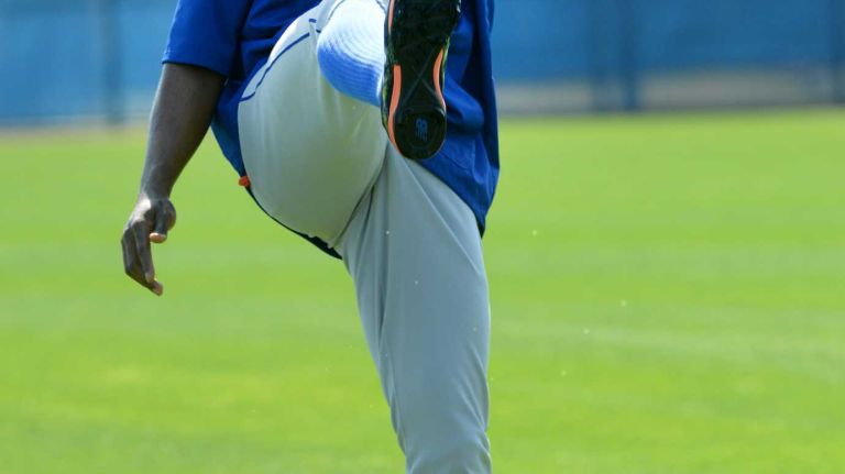 NY Mets outfielder Curtis Granderson warming up during a spring training workout Tuesday Feb 24, 2015.