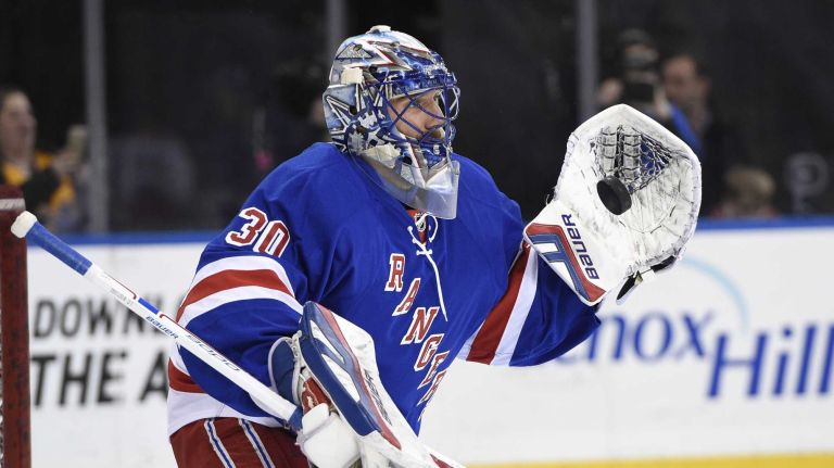 New York Rangers goalie Henrik Lundqvist warms up on the ice before the start of the NHL hockey game between the New York Rangers and the Washington Capitals at Madison Square Garden on Sunday, March 29, 2015.