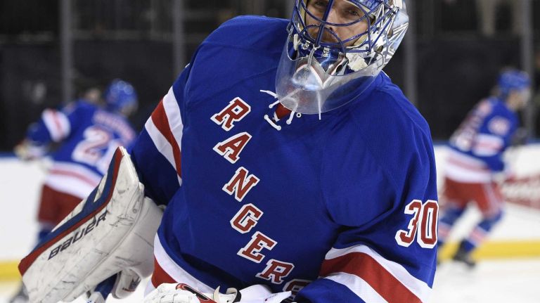 New York Rangers goalie Henrik Lundqvist warms up on the ice before the start of the NHL hockey game between the New York Rangers and the Washington Capitals at Madison Square Garden on Sunday, March 29, 2015.