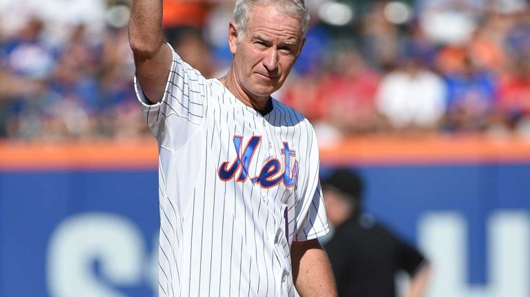 Celebrity first pitches at MLB games in 2015 2 Tennis star John McEnroe waves his Mets cap to fans before throwing out the ceremonial first pitch before a baseball game between the New York Mets and the Boston Red Sox at Citi Field on Saturday, Aug. 29, 2015.