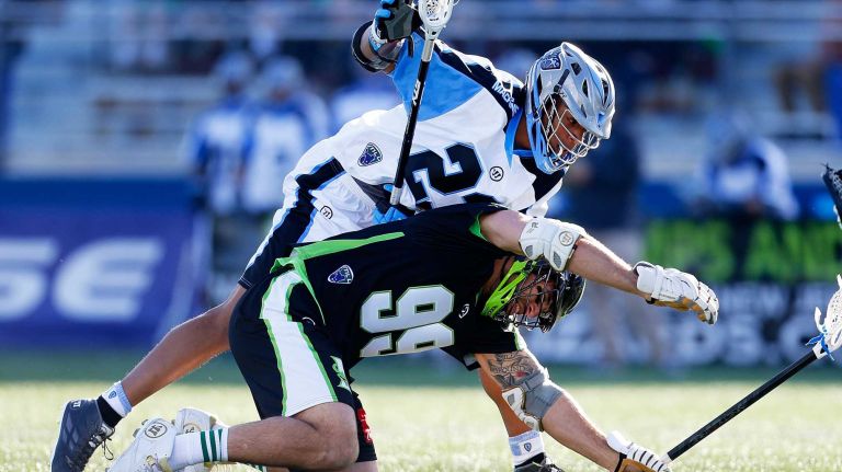 NY Lizards vs. Ohio Machine 29 HEMPSTEAD, NY - APRIL 12: Paul Rabil #99 of the New York Lizards is knocked to the ground by Dominique Alexander #23 of the Ohio Machine at James M. Shuart Stadium on April 12, 2015 in Hempstead, New York. (Photo by Mike Stobe/Getty Images)