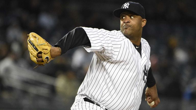New York Yankees starting pitcher CC Sabathia delivers in the first inning against the Toronto Blue Jays in a baseball game at Yankee Stadium on Thursday, April 9, 2015.