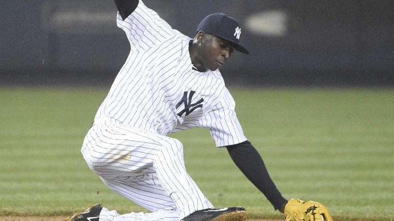 Yankees shortstop Didi Gregorius stops the ball hit by Toronto Blue Jays third baseman Josh Donaldson during a game at Yankee Stadium on April 9, 2015.