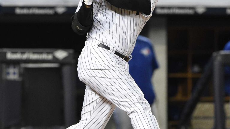 New York Yankees designated hitter Carlos Beltran flies out in the third inning against the Toronto Blue Jays in an MLB baseball game on Yankee Stadium on Wednesday, April 8, 2015.