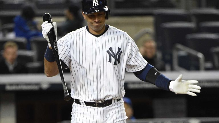 New York Yankees designated hitter Alex Rodriguez reacts after he strikes out in the first inning against the Toronto Blue Jays in an MLB game at Yankee Stadium on Wednesday, April 8, 2015.